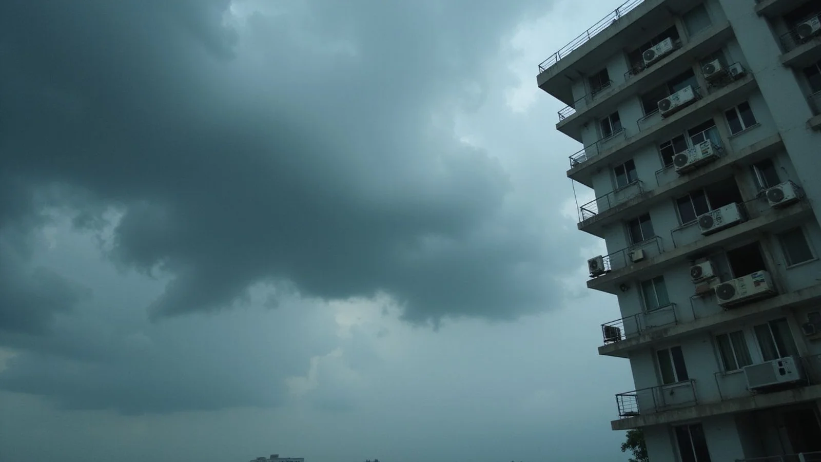 PJ monsoon clouds gathering over condo aircon units